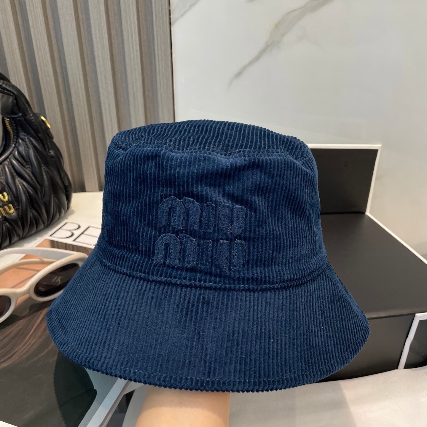 MM BUCKET IN NAVY BLUE VELVET WITH LOGO